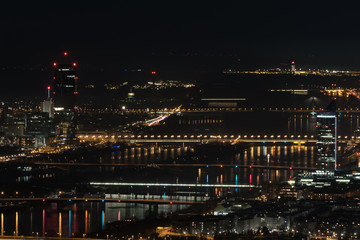 Vienna, aerial view at night with the river danube