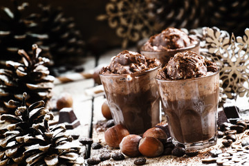 Hot chocolate drink topped with whipped cream and candy, christm