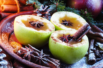 Apple cider with cinnamon and star anise in fresh green apples s