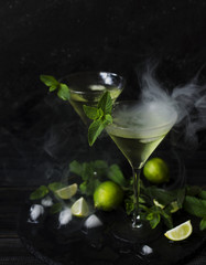 Martini or mint liqueur with lime, selective focus