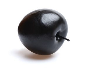 Black apple isolated on white