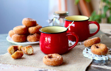 red cup tea wiht donuts