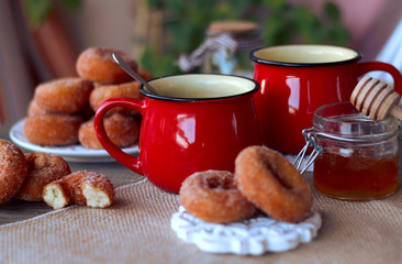red cup tea wiht donuts