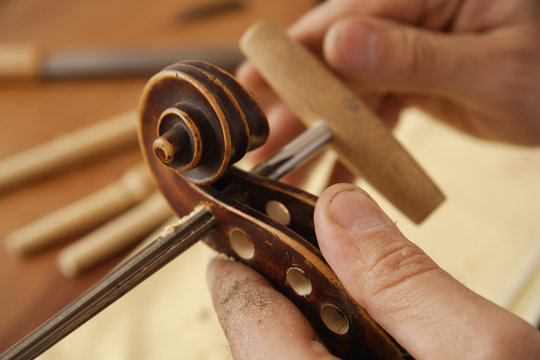 Germany, Upper Bavaria, Schaeftlarn, Violin maker making violin, close up