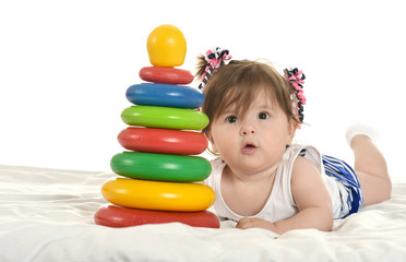 Baby girl playing with toys