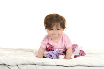 Fototapeta premium Baby girl on blanket in pink clothes