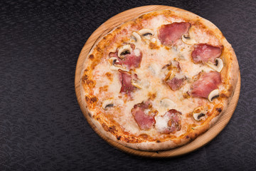tasty italian pizza with bacon and mushrooms