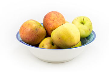 Naklejka na ściany i meble Windfall apples grouped in a bowl on a white background.