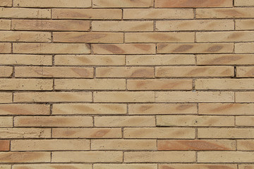 Texture - a wall of modern unusual yellow brick.