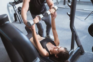  Asian woman lifting weight The supine Have personal trainer can © torwaiphoto