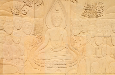 Carved Buddhist story on sandstone temple wall (At temple ,Thail