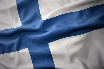 waving colorful flag of finland. - obrazy, fototapety, plakaty