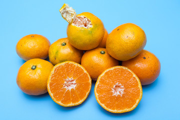 fresh and ripe oranges on blue backgrounds