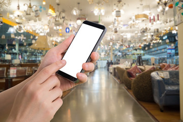 human hand hold smartphone, tablet, cell phone with blurry home