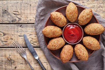 Kibbeh traditional middle eastern arabic lamb meat and bulgur kofta spicy meatball croquettes food on vintage wooden table background