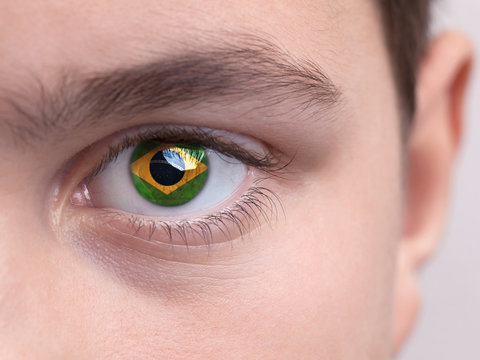 National flag of Brazil on a young boys iris