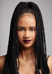 front view portrait of black woman wears braids
