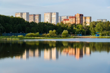 Fototapeta na wymiar School Lake in sunset light in Zelenograd district of Moscow, Russia