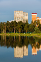 Fototapeta premium House reflected in lake at sunset light in Zelenograd district of Moscow, Russia