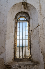 Fototapeta na wymiar Tall window of Portuguese fort in Lobito, Angola