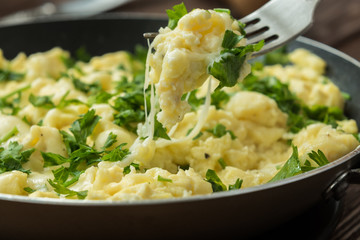 Perfect scrambled omelette with parsley and feta cheese