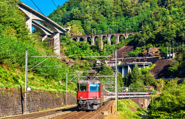 Naklejka premium Passenger train is going down the Gotthard pass - Switzerland