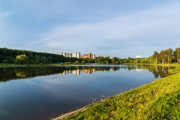 Fototapeta na wymiar School Lake in sunset light in Zelenograd of Moscow, Russia