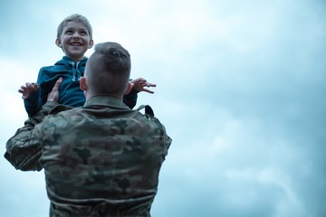 Soldier with his son in his arms