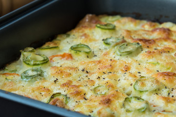 Roasted vegetables with cheese, egg and sour cream