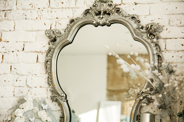Vintage interior with a mirror in beautiful frame - obrazy, fototapety, plakaty
