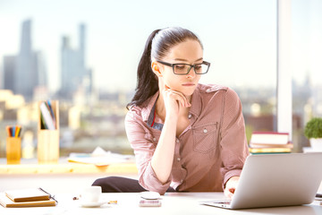 Beautiful female using laptop