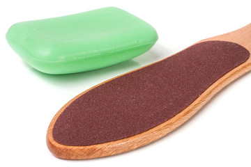 wooden double-sided grater for feet with soap isolated on white background