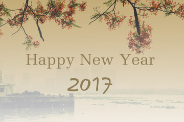 background of 2017 happy new year with red flamboyant and city building