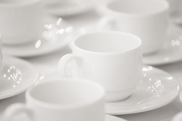 Line of white cups, on background