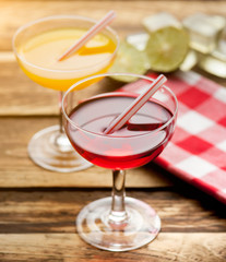 Various alcoholic cocktails on wood