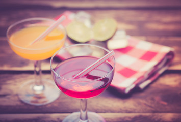 Various alcoholic cocktails on wood