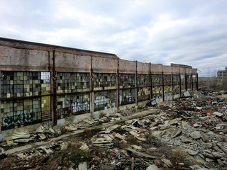 Partially demolished vintage building with grungy windows