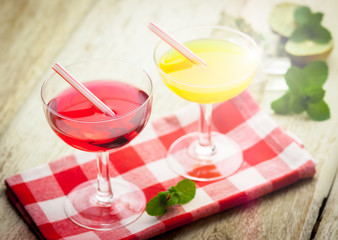 Various alcoholic cocktails on wood