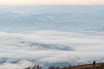 Siilhouette of man at amazing picturesque landscape of Carpathia