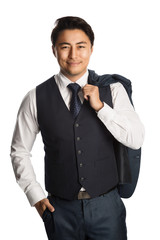 Attractive well dressed businessman wearing a white shirt, vest and tie, with his jacket over his shoulder standing against a white background smiling.
