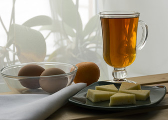 Tea, cheese, boiled eggs, tangerine, useful, tasty Breakfast, mo