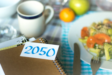 2050; Stack of Documents. Working or Studying while Eating.