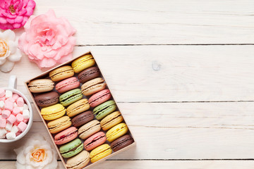 Colorful macaroons in a box and marshmallow