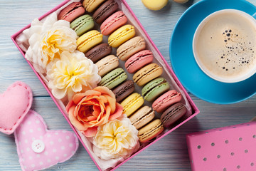 Colorful macaroons, coffee. Sweet macarons