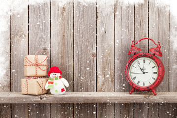 Christmas gift boxes, alarm clock and snowman