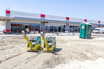 Vibration plate compactor machine is standing at building site