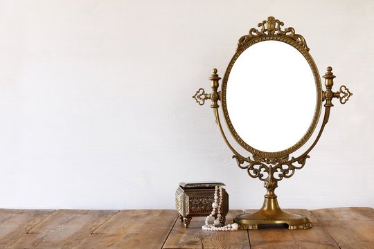 Old vintage mirror and woman toilet fashion objects