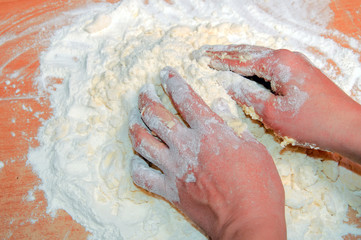  Young girl preparing the dough.