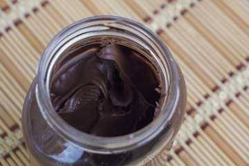 Sweet chocolate cream in jar