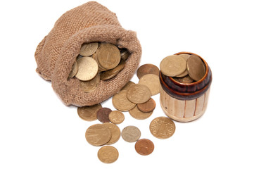 Bag with coins barrel with coins on a white background.